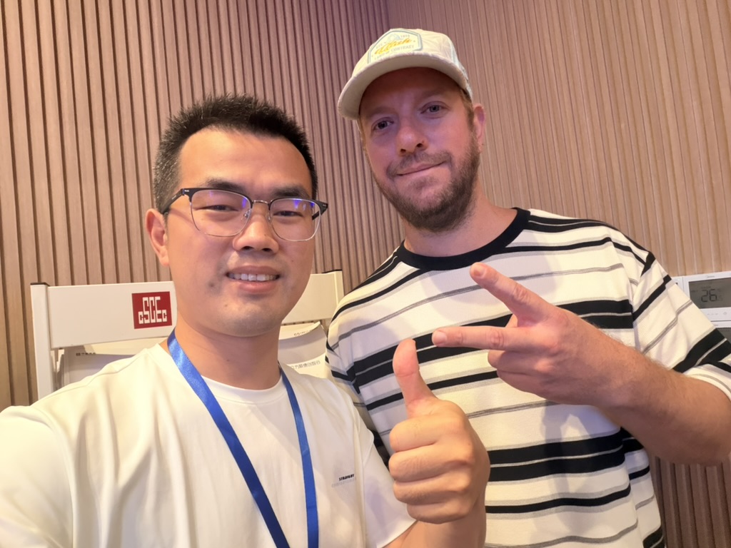 An ONETWOSAIL representative with a business contact during a visit in China.